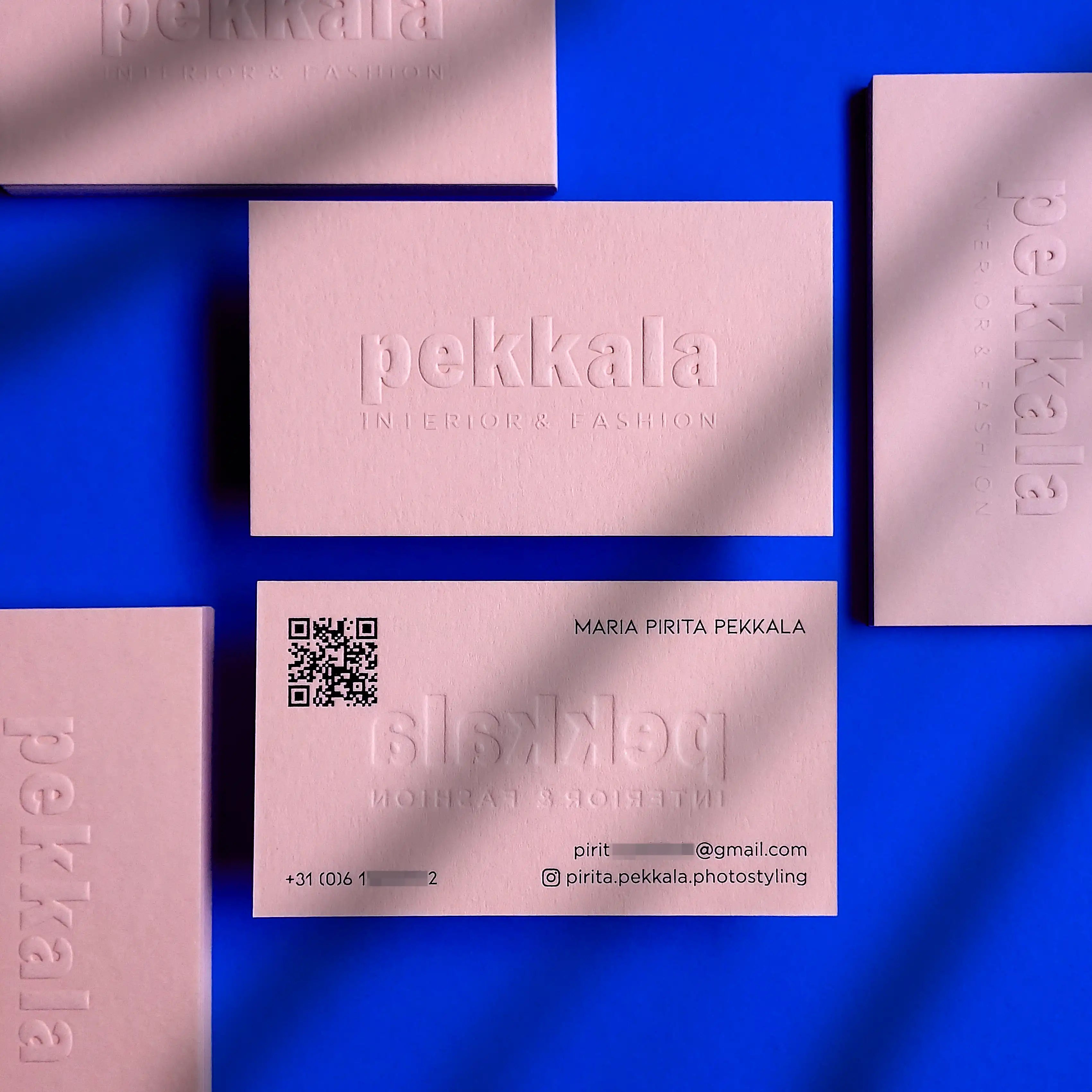 Embossed pink business card with glossy black foil text and luxury finish - OddPlanPrint